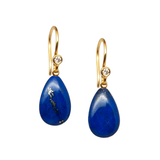 Pair of lapis lazuli gold earrings with blue teardrop stones and diamonds on a white background