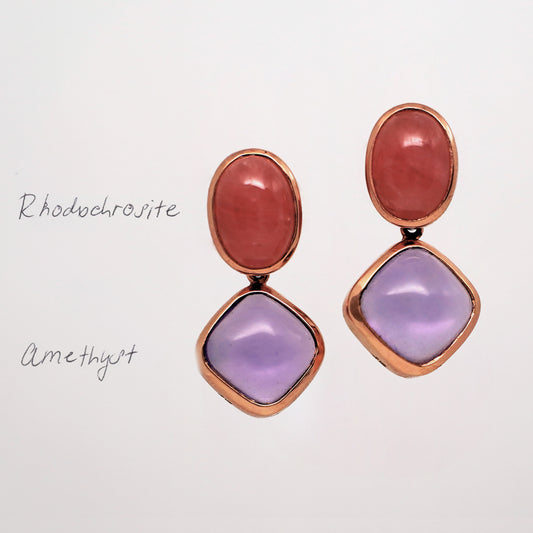 Rhodochrosite and Amethyst Gemstone Stud Earrings. Pair of earrings with pink and purple stones in rose gold on a light gray background