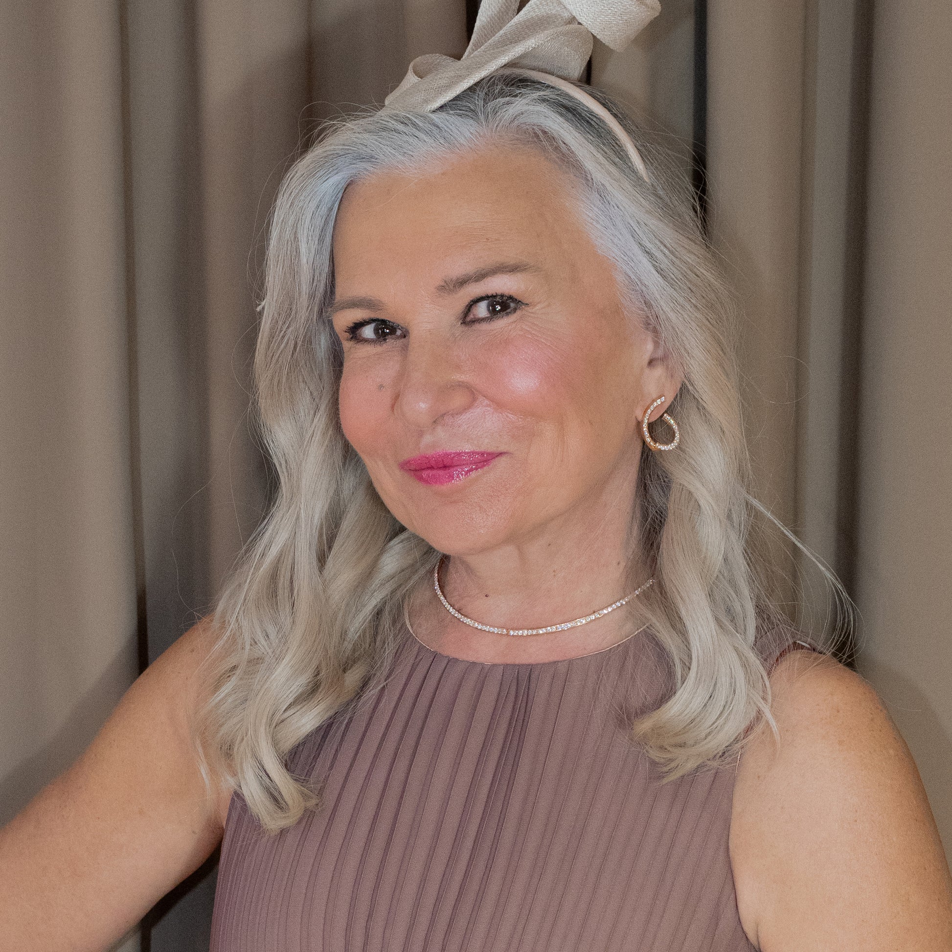 Rose Gold necklace and earrings with diamonds on a model