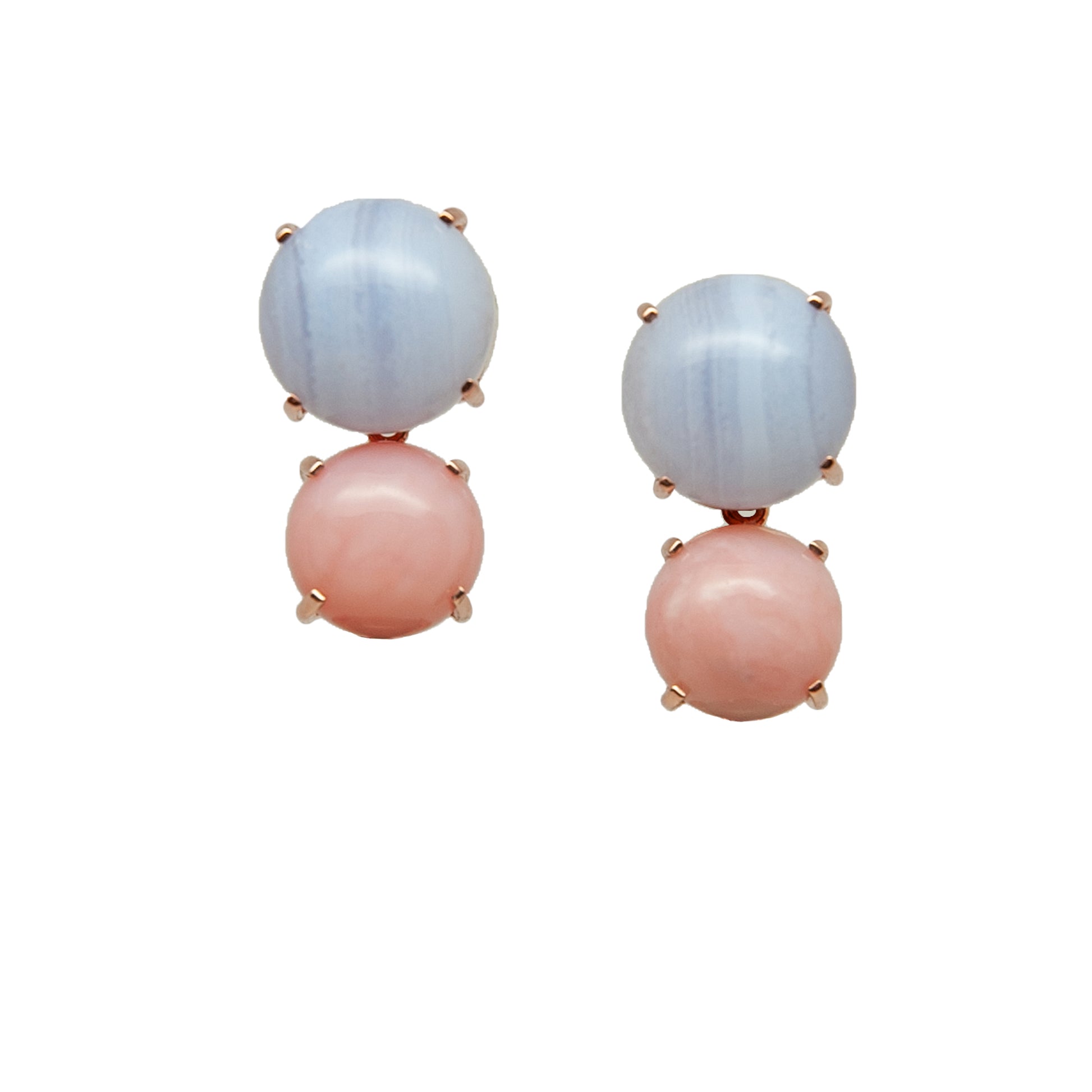 Pair of earrings with pink and blue gemstone on white background